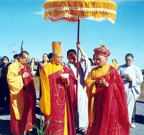 Monks under umbrella